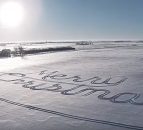 Video: Farmer creates 'Merry Christmas' in snow with tractor