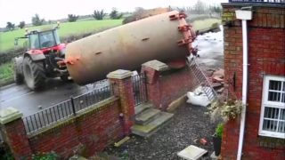 Video: Dramatic footage of slurry tank crashing through a garden wall