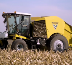 Self-propelled round baler moves on...to maize stalks