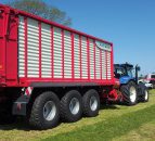 Grass & Muck: 3-axle monster flies flag for wagon fanatics