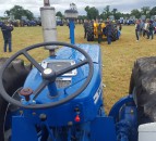 99 County tractors cluster together in one field