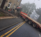 Tractor and low-loader involved in collision with house
