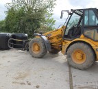 What is the correct way to stack round bales of silage?