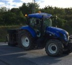 Livestock trailer carrying 12 cows overturns at roundabout