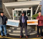 Tractor club delivers Christmas cheer with cheques to charity