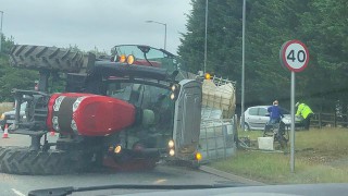 Tractor overturns in collision on A47 slip road