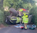 Tractor overturns on country lane in Gloucestershire