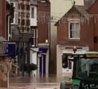 Video of tractor driving through flooded high street leads to arrest