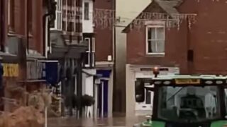 Video of tractor driving through flooded high street leads to arrest